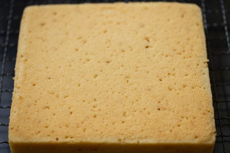 sponge cake removed from tin and continuing to cool on rack