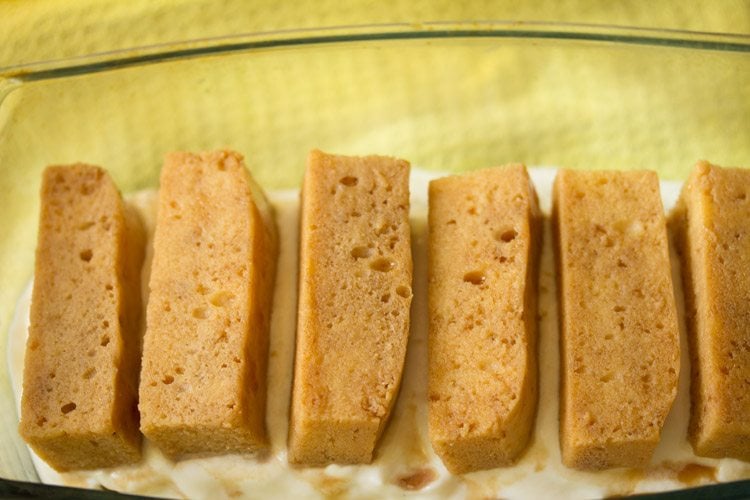 second layer of soaked ladyfingers stacked atop cream filling