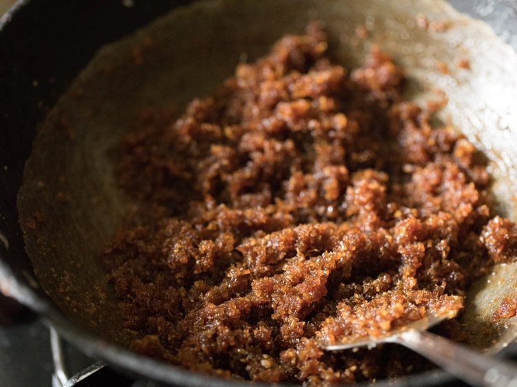 cooking coconut-jaggery mixture. 