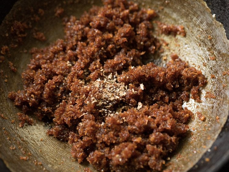 cardamom powder added to cooked coconut-jaggery mixture. 