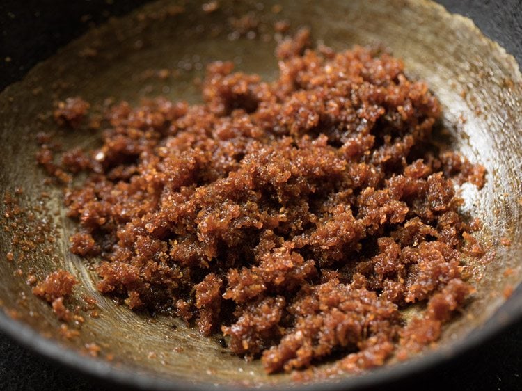 cooked coconut-jaggery mixture kept for cooling. 