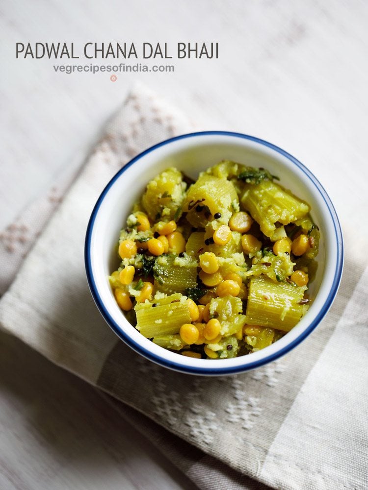 snake gourd recipe served in a blue rimmed white bowl with text layovers.