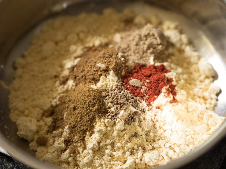 ground spices added to gram flour. 