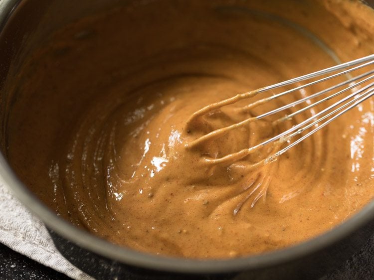 whisking ingredients together to make batter. 