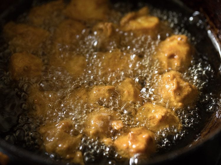 frying paneer cubes till golden and crisp. 