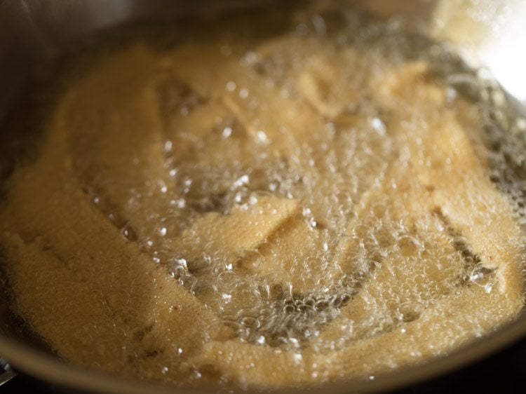 frying ribbon pakoda in hot oil. 