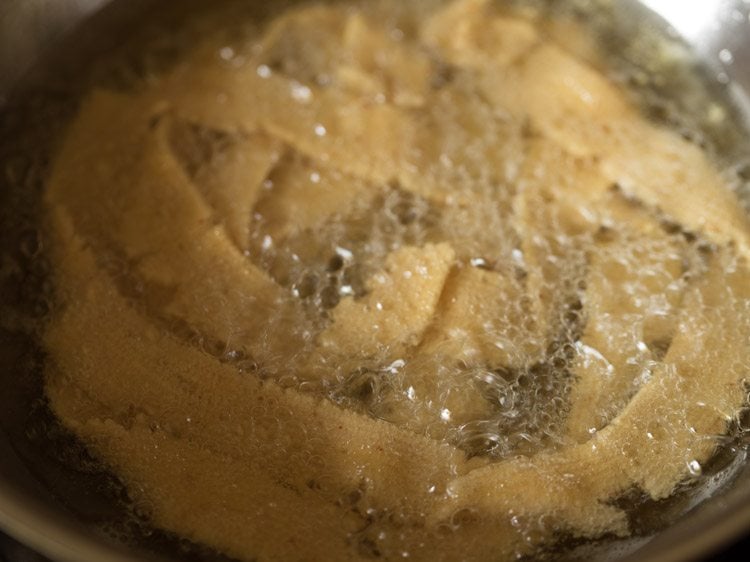 frying ribbon pakoda in hot oil. 