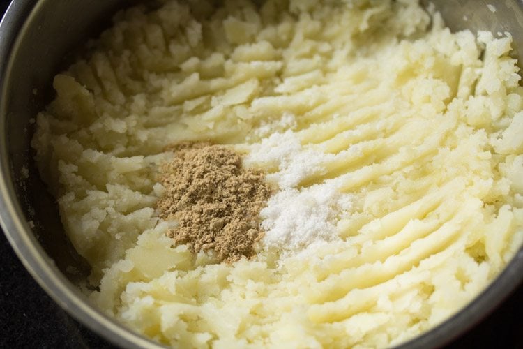 chaat masala and salt added to mashed potatoes for making bread patties. 