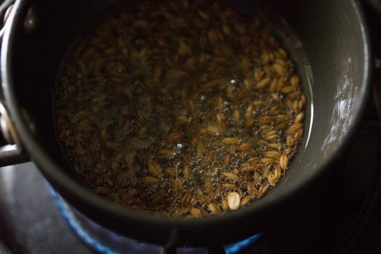 frying urad dal till it is golden. 