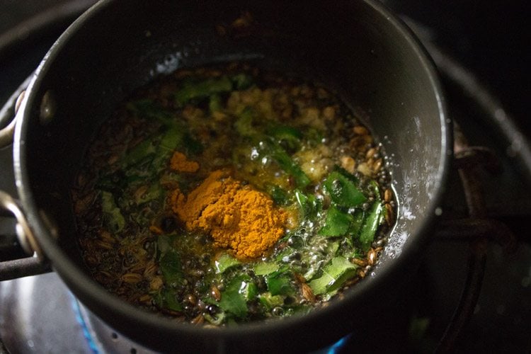 turmeric powder added to spice mixture. 