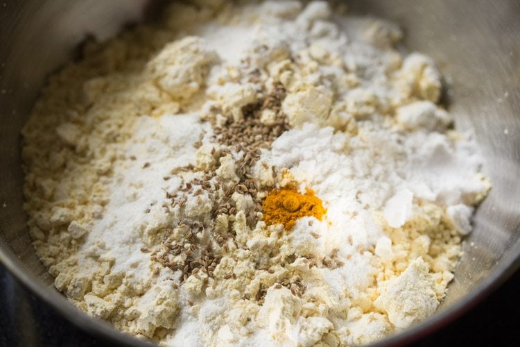 carom seeds, turmeric powder and salt added to the flours. 