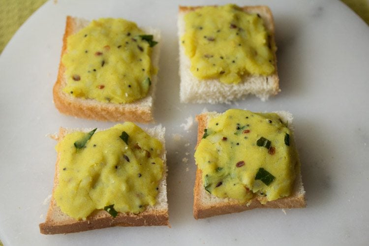 bread pieces topped with prepared potato mixture. 