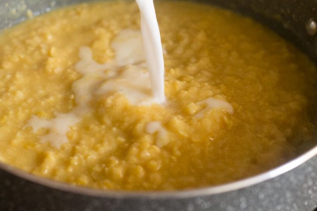 adding thin coconut milk to the mashed chana dal. 