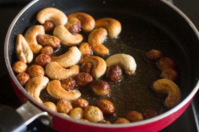 frying raisins and cashews till plump and browned.