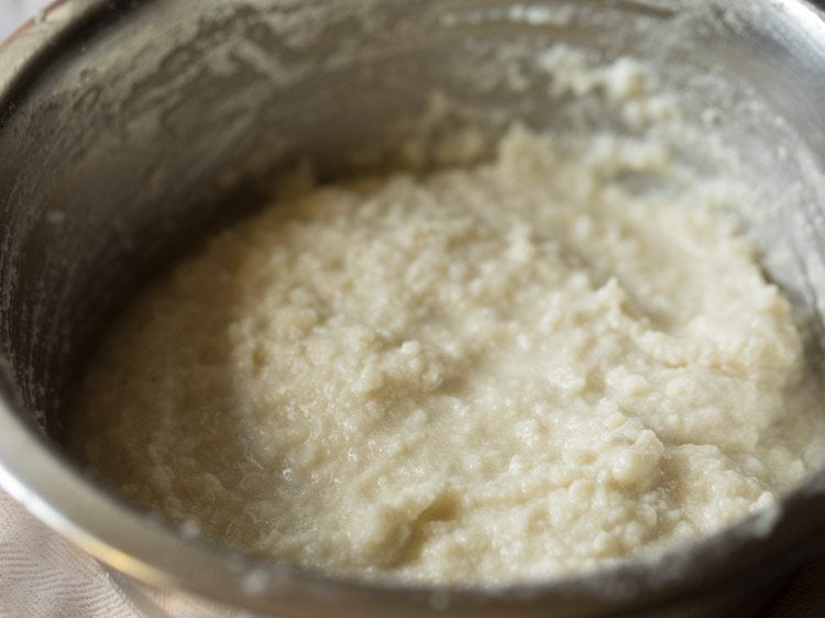 mashing chenna mixture for making chenna poda. 