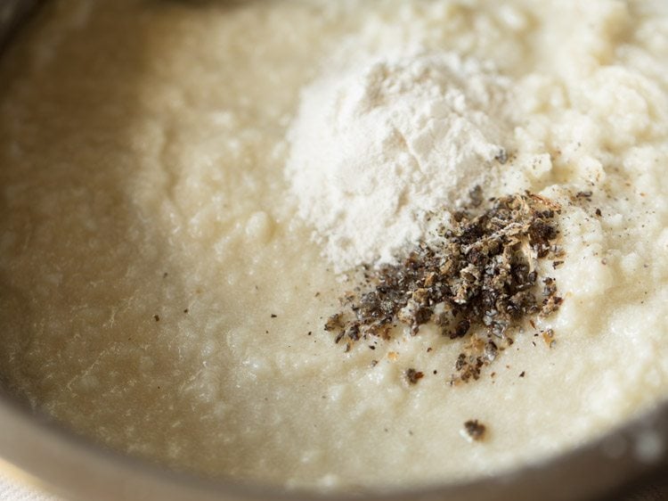 cardamom powder and rice flour added to mashed chenna mixture for making chenna poda. 