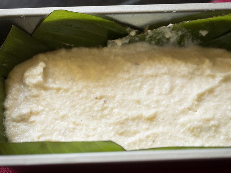 chhena poda mixture spread evenly in the prepared pan. 