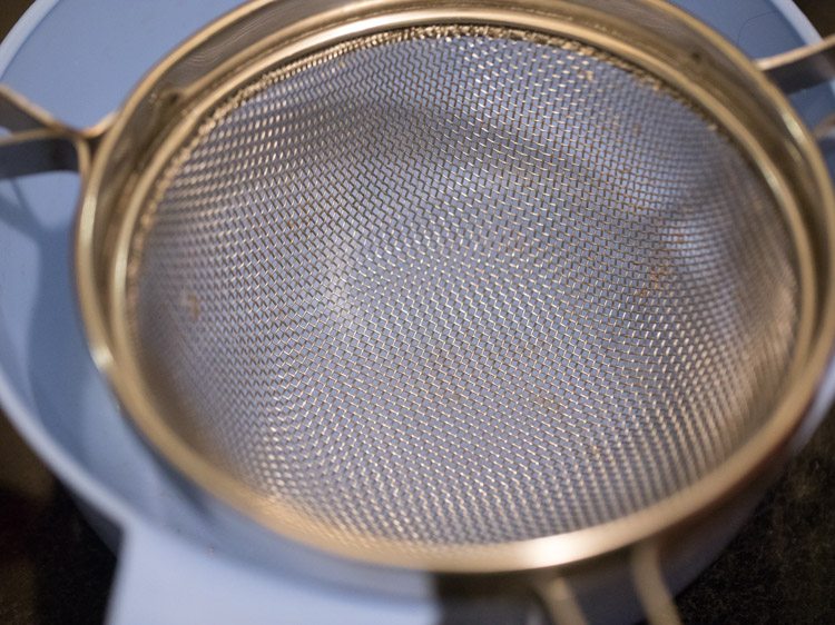 a strainer on a towel
