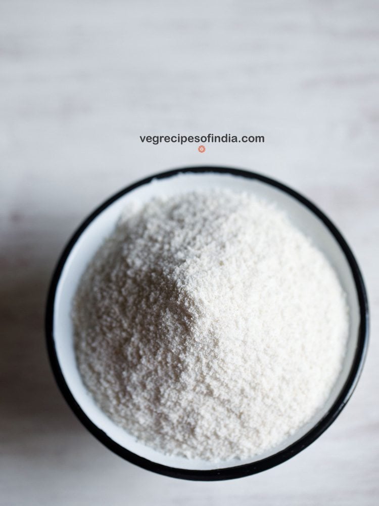 homemade rice flour in a black rimmed bowl with text layovers. 