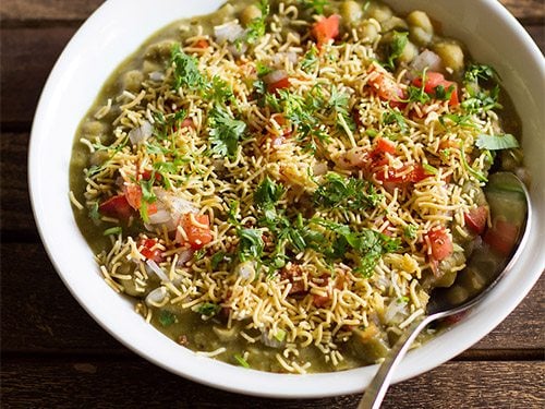 bangalore masala puri chaat in a bowl with spoon.