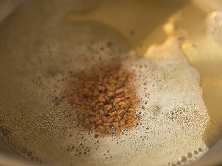 fenugreek seeds added in the pan. 