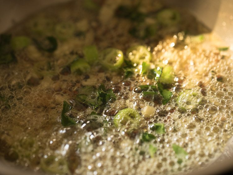 frying ingredients in the pan. 