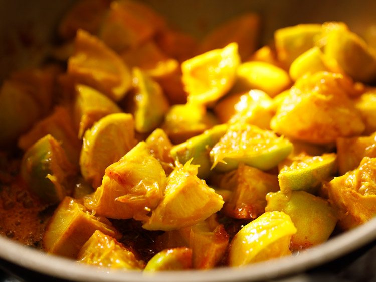 lemon pieces added in the pan. 