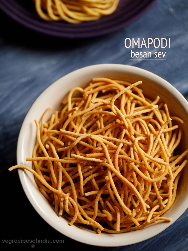 omapodi served in a cream colored bowl with text layovers.