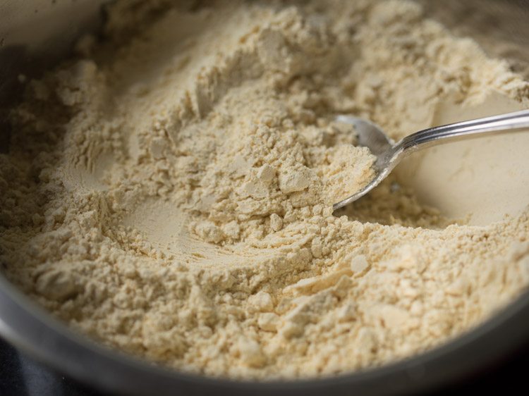 mixing the spice powders and seasonings well into the flours with a spoon. 