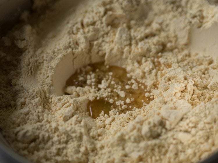 hot oil added to the spiced flour mixture for making omapodi. 