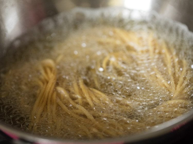 frying omapodi in hot oil. 