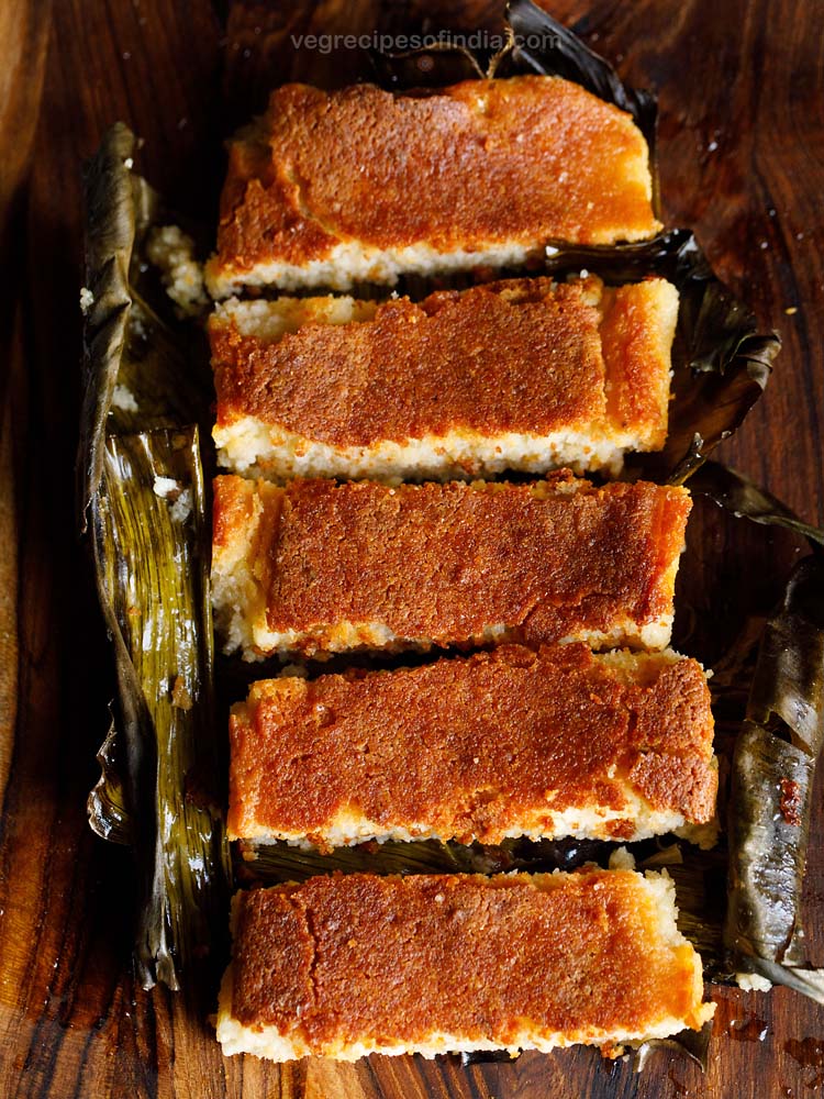 chhena poda sliced thickly and served in a banana leaf.