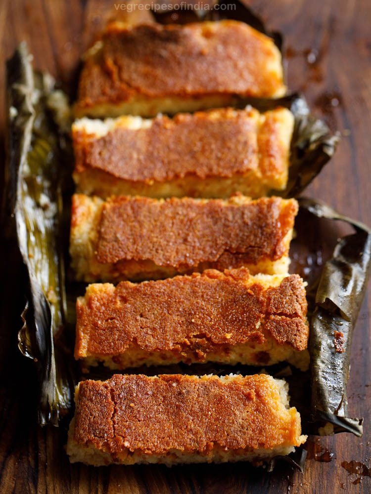 chhena poda sliced thickly and served in a banana leaf. 