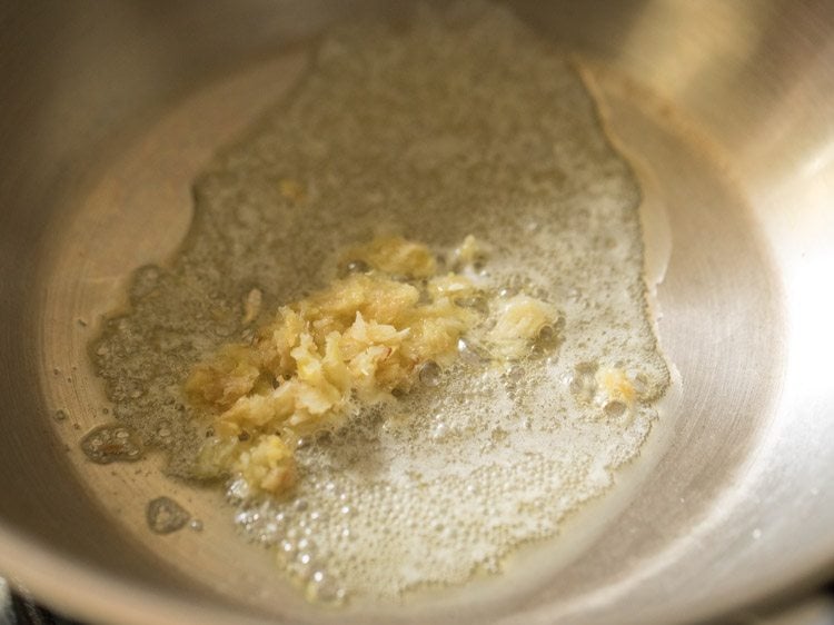 ginger-garlic paste added to melted butter in the pan. 
