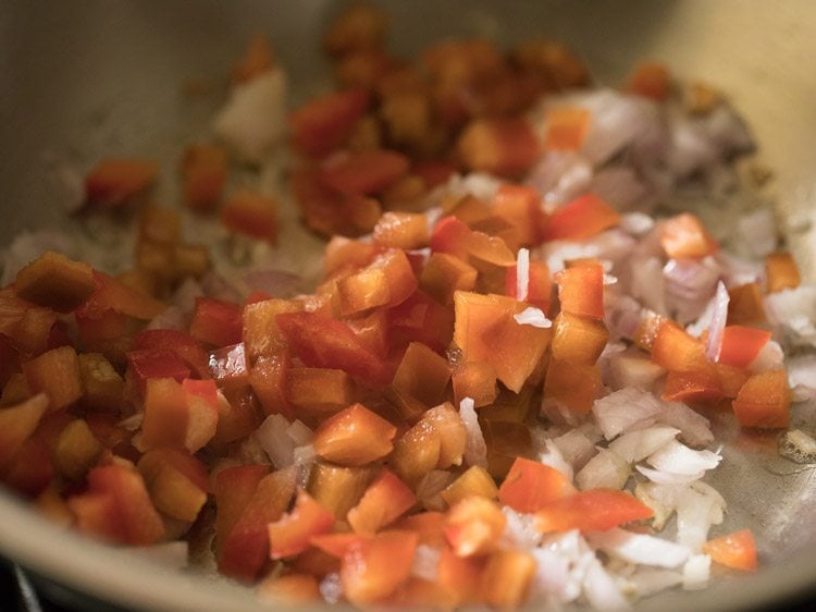 finely chopped red capsicum added to the onions. 