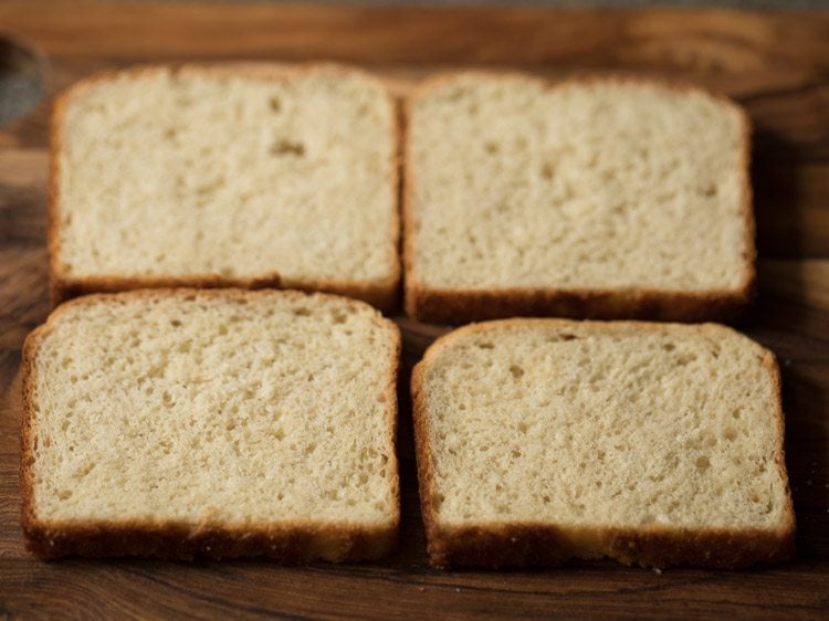 4 bread slices on the chopping board. 