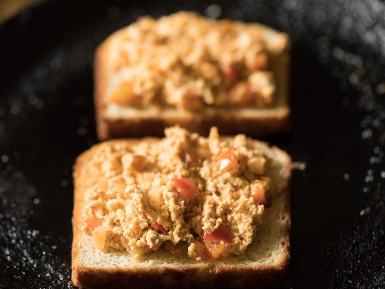 toasted bread slices topped with the prepared paneer mixture. 