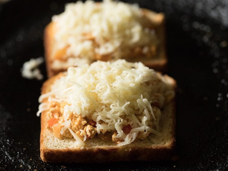 paneer mixture topped with grated mozzarella cheese. 