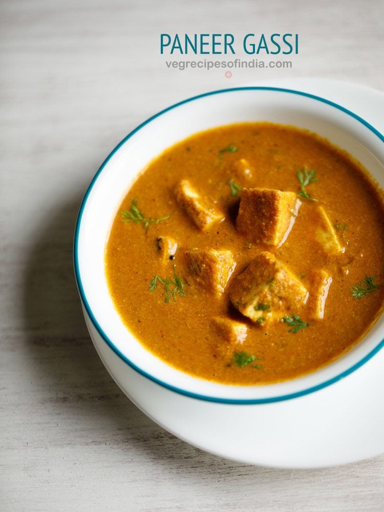 paneer gassi served in a light blue rimmed white bowl with text layovers.