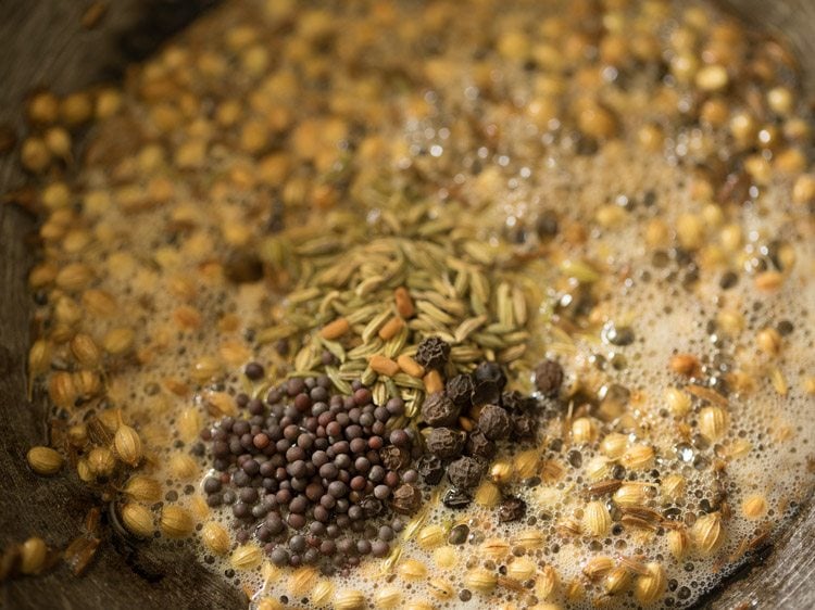 fennel seeds, mustard seeds, whole black pepper and fenugreek seeds added to the pan. 