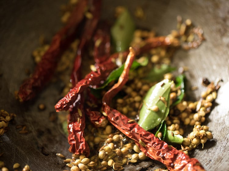 red chilies and curry leaves mixed well with the spice mixture. 