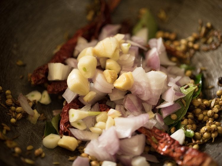 chopped onion, chopped garlic and chopped ginger added to the spice mixture. 