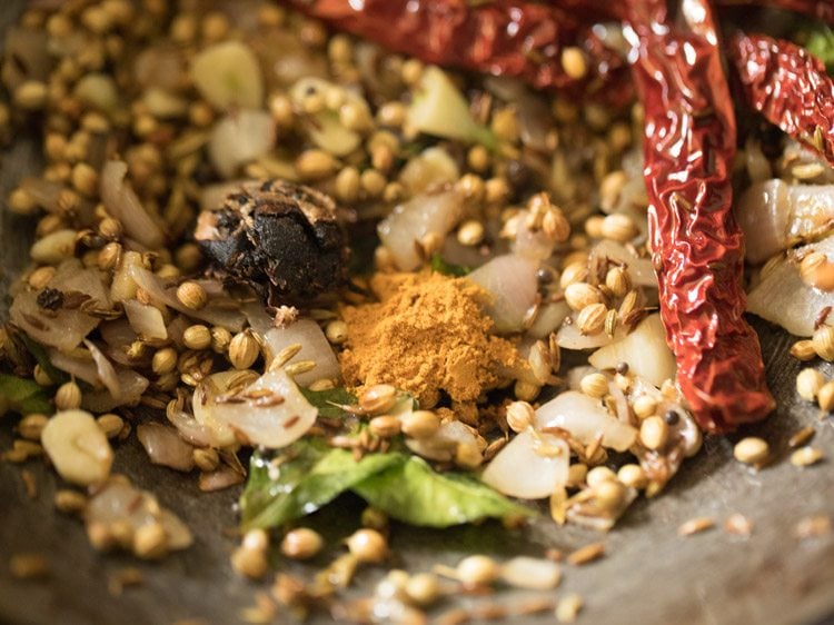 tamarind and turmeric powder added to the pan after switching off the heat. 