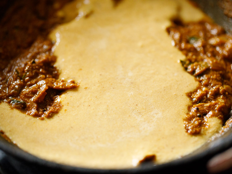 jaggery powder and prepared coconut paste added to the pan. 