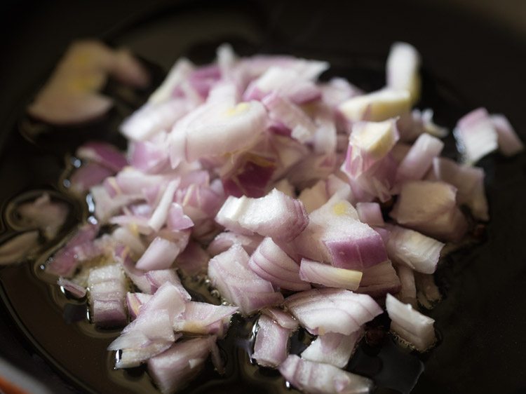 chopped onions added to the whole spices. 