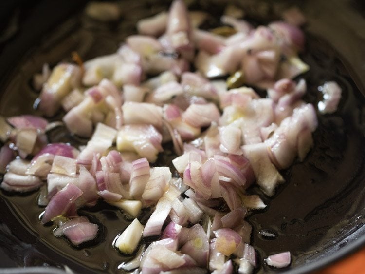 sautéing onions with whole spices. 