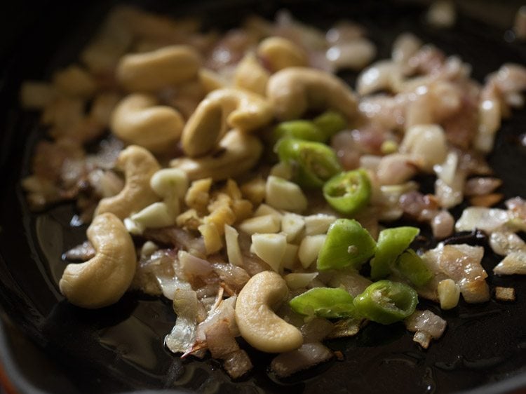 chopped ginger, chopped garlic, chopped green chili and cashews added to the onions. 