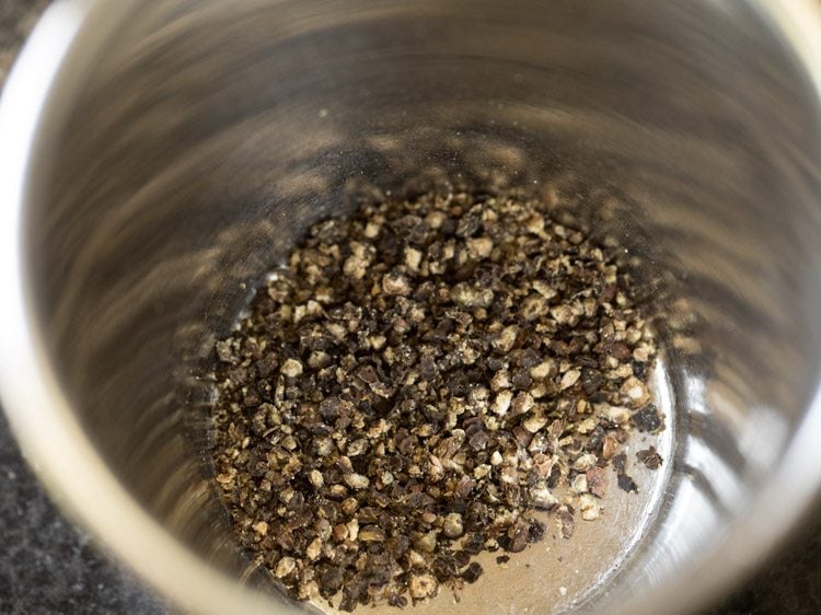 whole black pepper crushed to a coarse powder. 