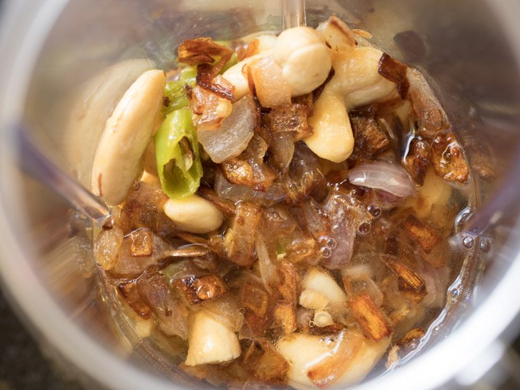 cooked onion mixture and water added to a grinder jar. 