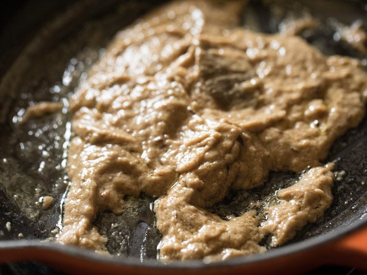 sautéing onion paste till oil releases from the sides of the paste. 